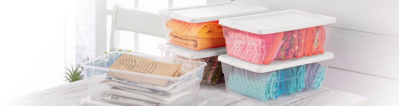 a stack of containers stacked on top of each other on a table