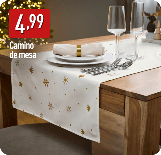 Camino de mesa blanco con estampado dorado de copos y estrellas sobre una mesa de madera con vajilla festiva. A la izquierda, el precio 4,99 € y texto: Camino de mesa.