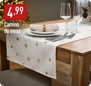 Camino de mesa blanco con estampado dorado de copos y estrellas sobre una mesa de madera con vajilla festiva. A la izquierda, el precio 4,99 € y texto: Camino de mesa.