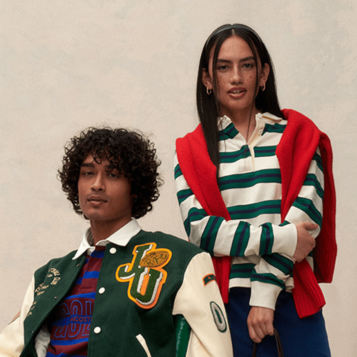 Two models, a man and a woman, in very preppy clothing.