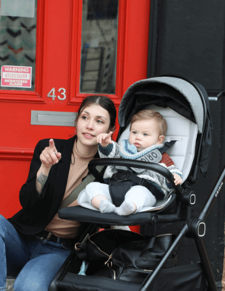 Mother and baby in ORIGIN Fantail buggy. Save $100 on selected ORIGIN buggies