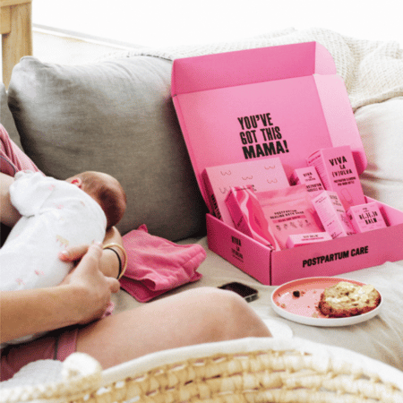 Viva La Vulva package next to mother breastfeeding