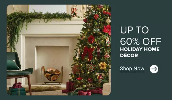 Up to 60% off holiday home decor. Shop now. A decorated Christmas tree with ornaments next to a fireplace lined with garland.