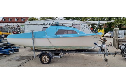 Skipper yacht with sail and Evinrude engine store…