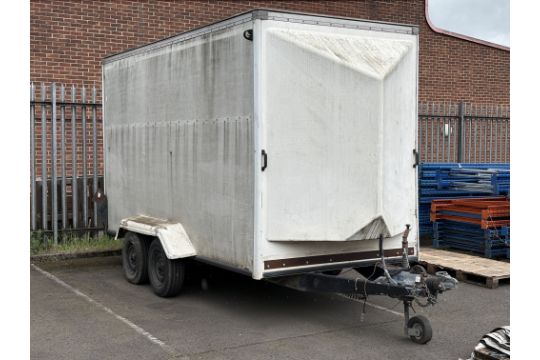Twin axle box trailer with rear roller door. This lot…