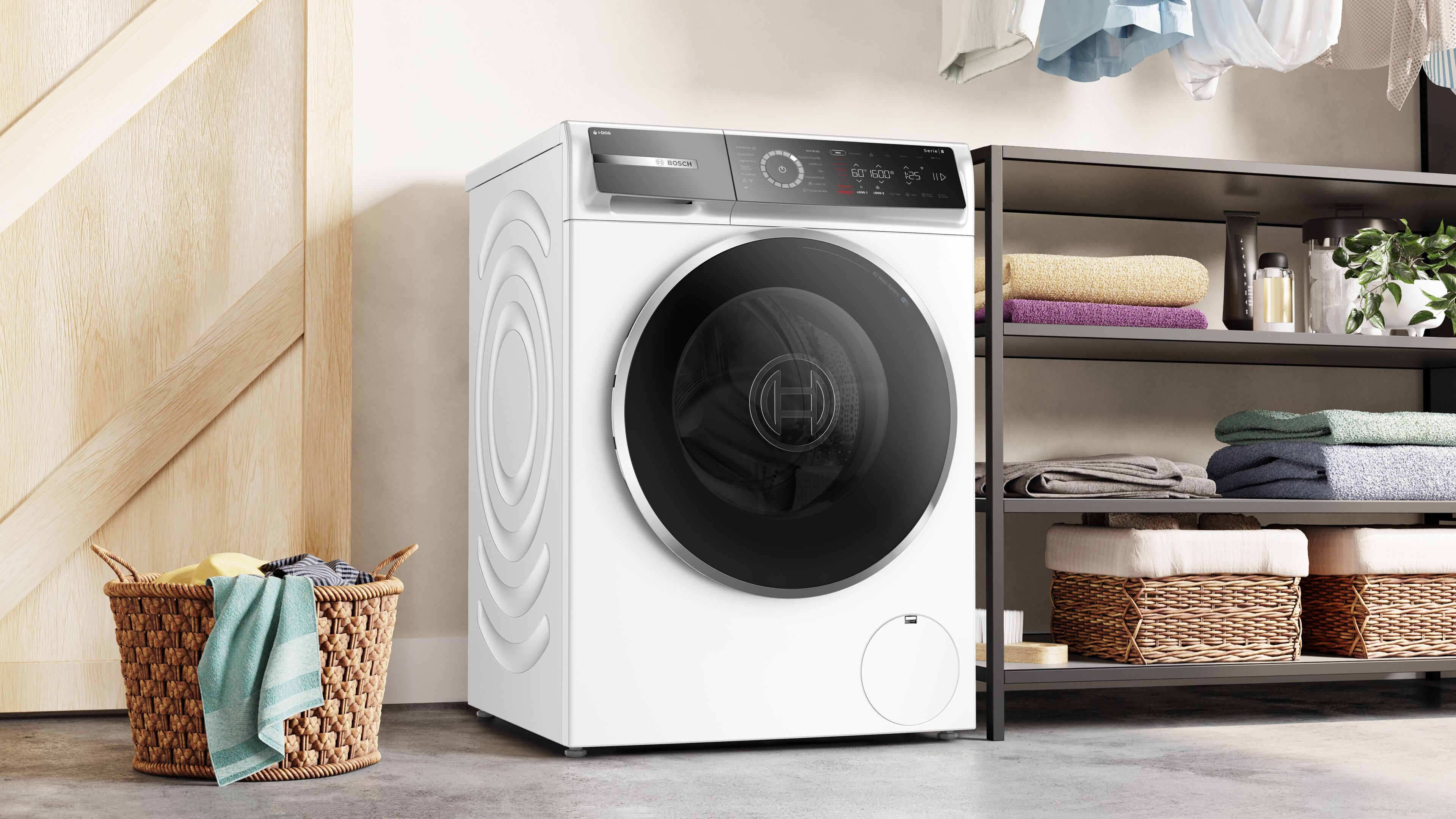 Uma m&aacute;quina de lavar roupa Bosch branca com um cesto de roupa suja de vime e uma prateleira com toalhas dobradas e produtos de lavandaria.