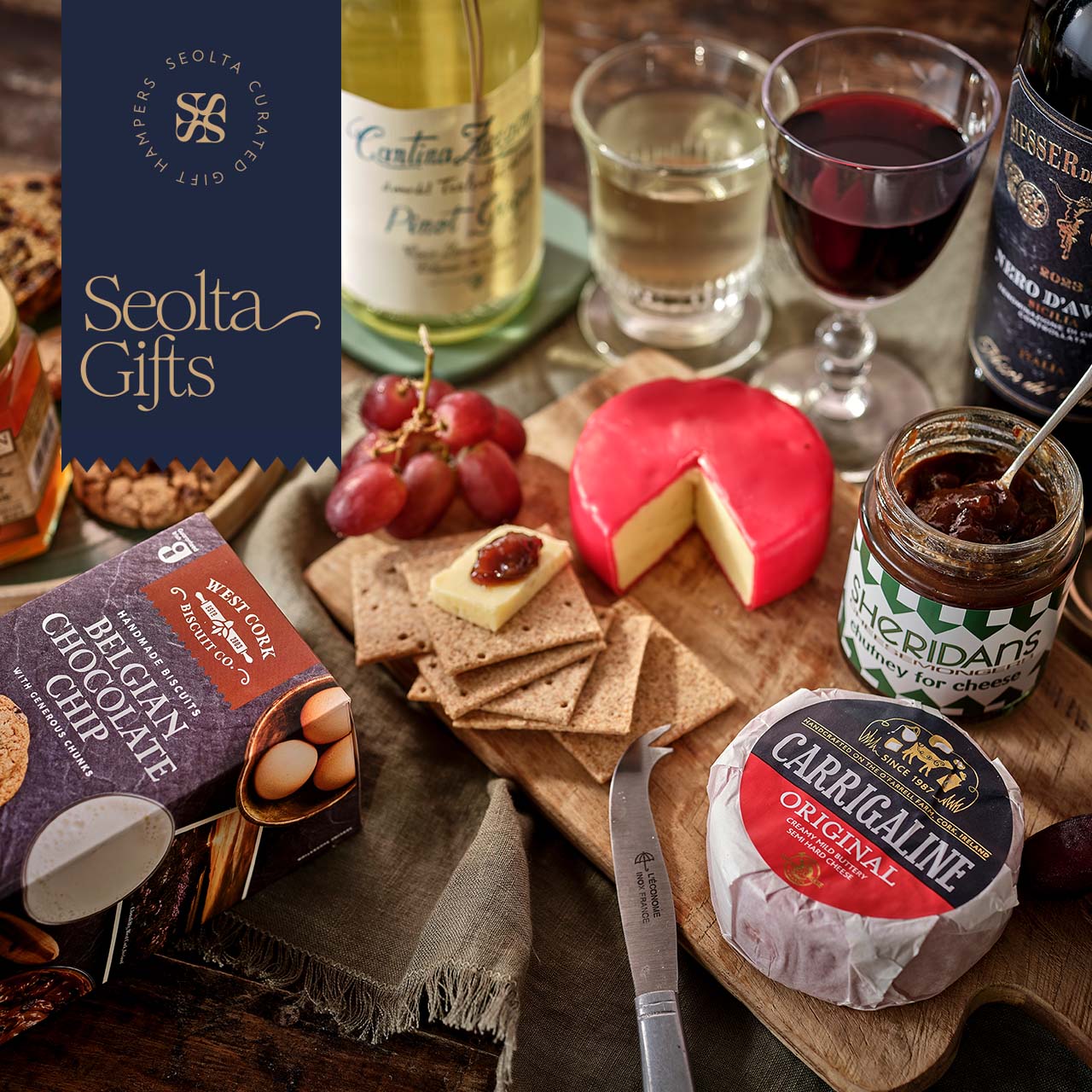 an image of a table with a variety of cheeses and wine