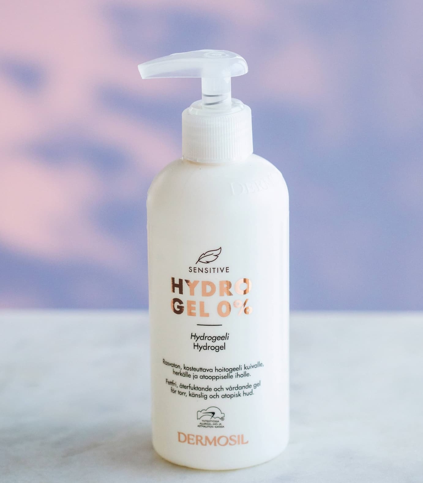 an image of a bottle of liquid sitting on a table in the snow