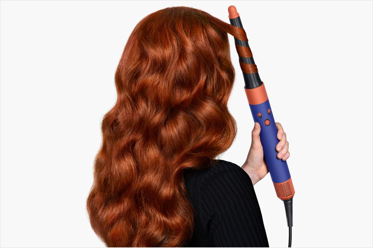 Model with red hair using the conical barrel.