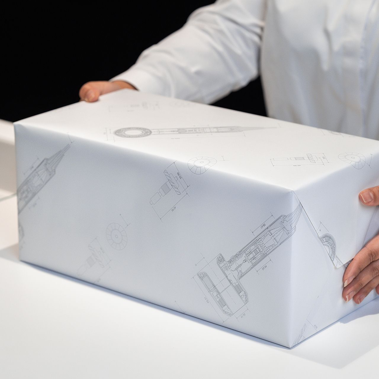 A Dyson Beauty device is wrapped for gifting in a Dyson store.