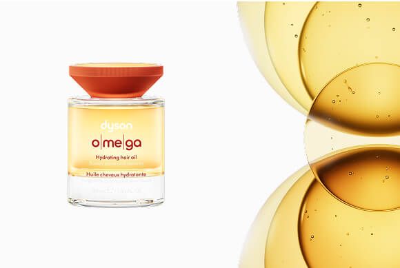El aceite capilar hidratante Dyson Omega junto a una mezcla de aceites.