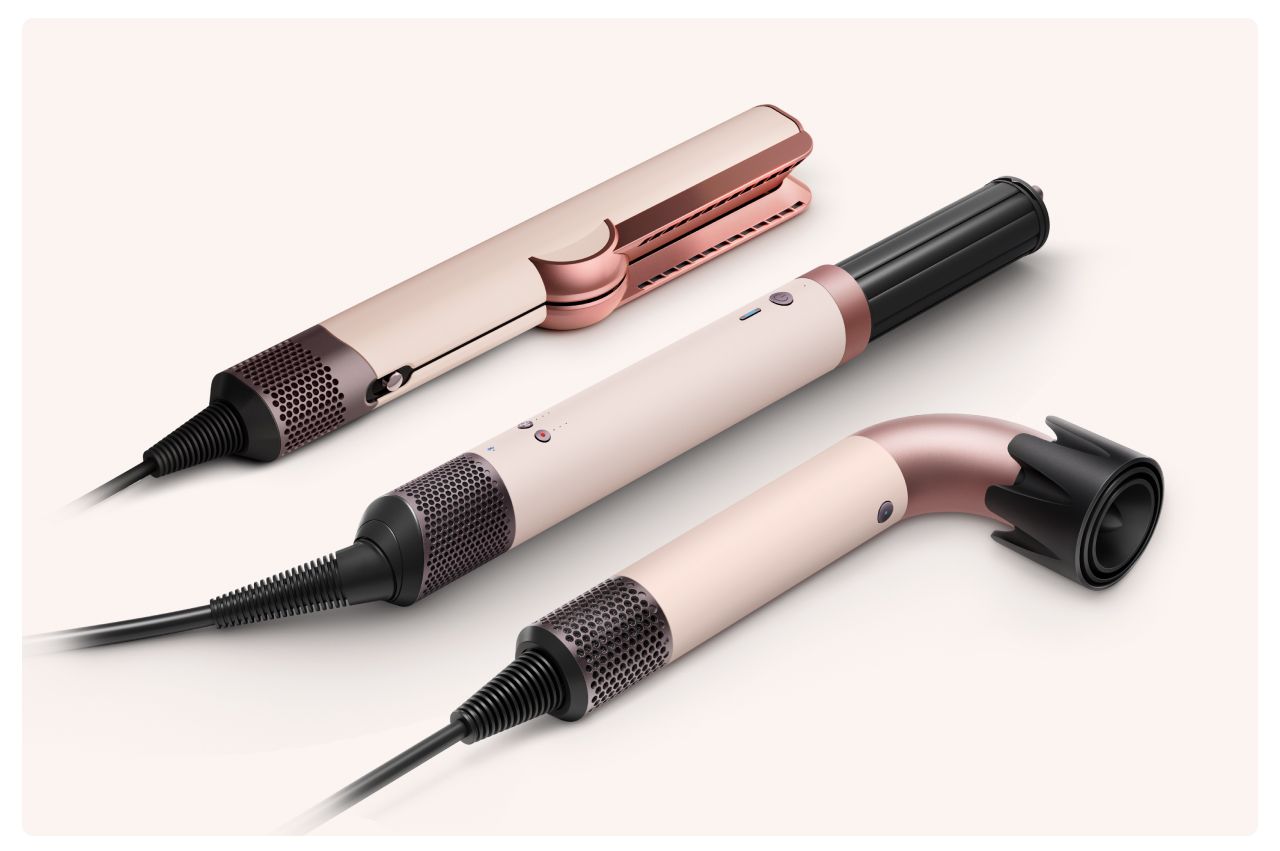 A collection of devices from the Dyson Beauty range in Ceramic pink and rose gold.
