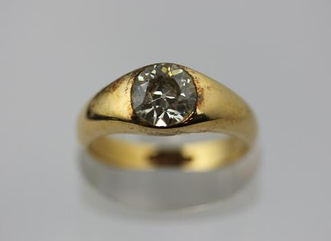 A gold and diamond single stone ring, gypsy set with a cushion shaped diamond, detailed '18ct'