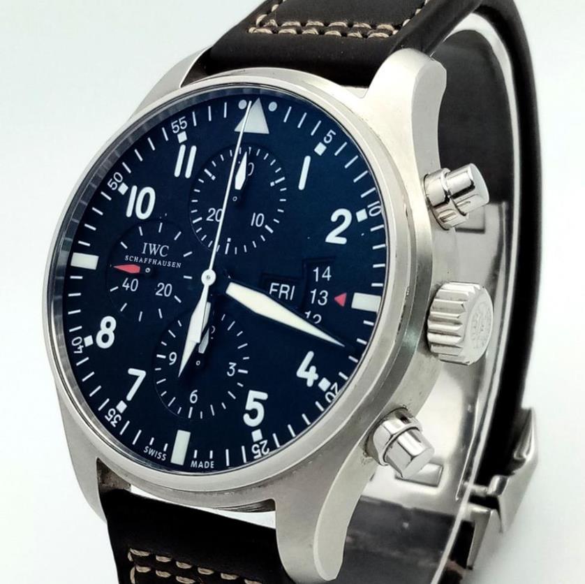 An IWC Flieger Chronograph Gents Automatic Watch. Original Brown Leather Strap and Clasp. Stainless Stell Case - 43mm. Black Dial With Three Sub Dials.