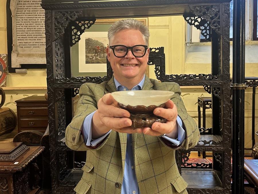 Richard Bromell with the Chinese Jade bowl at Charterhouse Auctioneers.