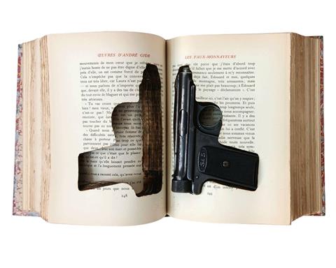 A French book with Cut Out Pages Hiding a German 1913 Model Saur & Sohn 7.65 Automatic pistol