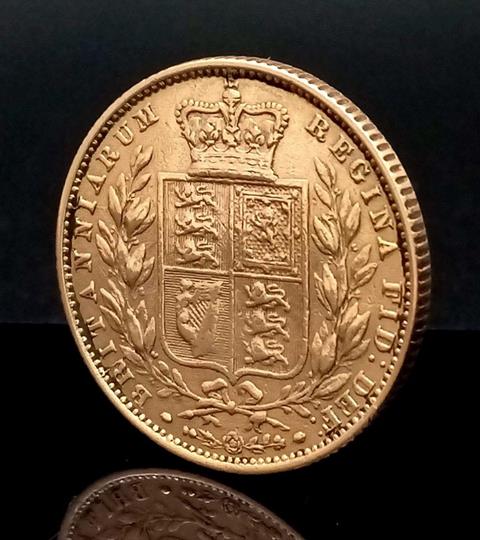 An 1860 Queen Victoria 22K Gold Full Sovereign - Young Queen head with shield reverse.