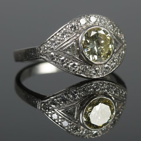 A Platinum and Diamond Ring in Eliptical Setting, Having Large Central Yellow Diamond