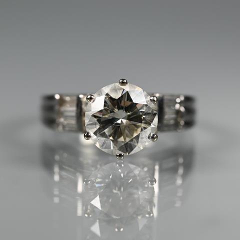 A Diamond Ring, the Central Round Brilliant Cut Stone With Four Round Brilliant Cut Diamonds to Each Side