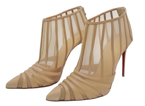 A pair of Christian Louboutin Baleine Heels. Beige mesh with leather stripes, pointed toe, and zip closure at the back.