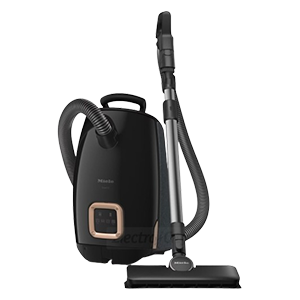 Black canister vacuum with hose and nozzle.