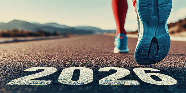 Runner on road with "2026" marking.