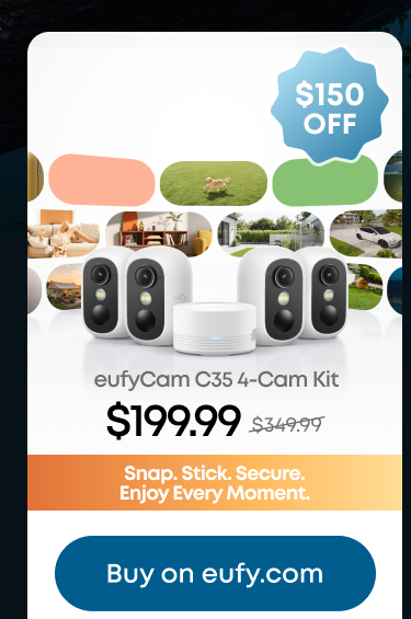 Man in a gray blazer over a dark gray shirt standing on stairs in an urban background.