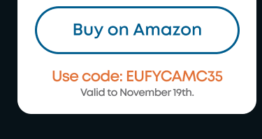 Man in a gray blazer over a dark gray shirt standing on stairs in an urban background.