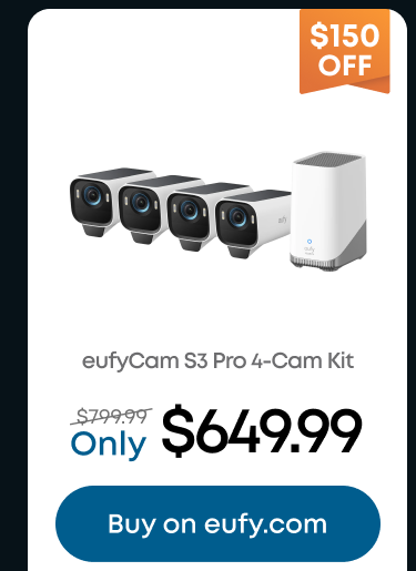 Man in a gray blazer over a dark gray shirt standing on stairs in an urban background.