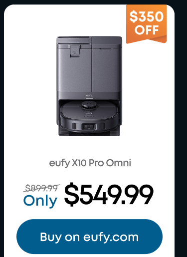 Woman wearing an olive green blazer and light blue jeans walking in an urban setting.