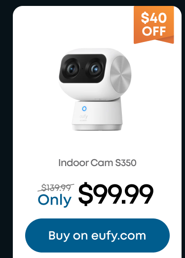 Man in a gray blazer over a dark gray shirt standing on stairs in an urban background.