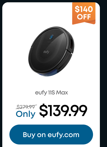 Woman wearing an olive green blazer and light blue jeans walking in an urban setting.