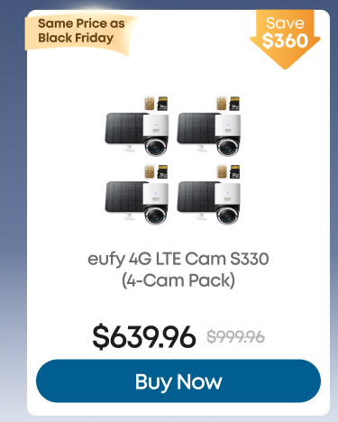 Man in a gray blazer over a dark gray shirt standing on stairs in an urban background.