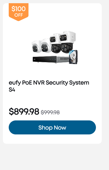 Woman wearing an olive green blazer and light blue jeans walking in an urban setting.