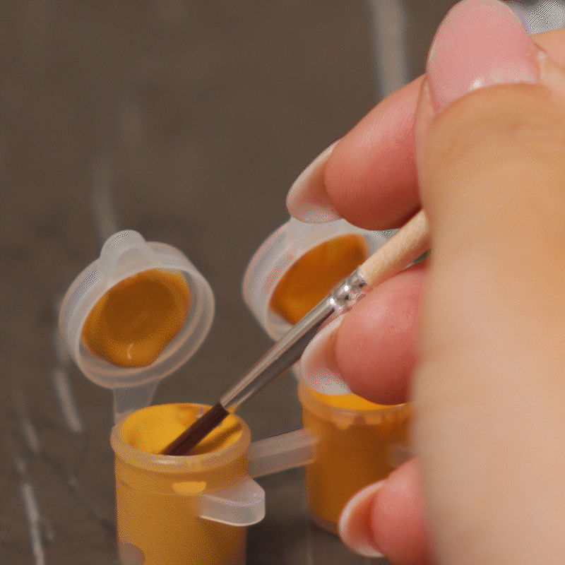 GIF showing one painting the DIY Pumpkin Mug