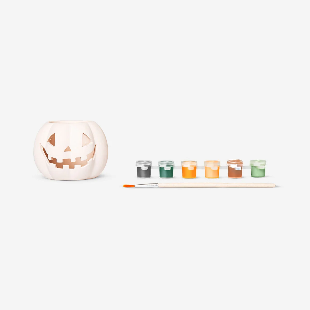 DIY pumpkin tealight holder with paint and brush