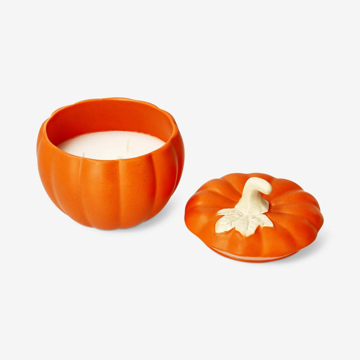 Scented candle presented in a ceramic pumpkin-shaped jar