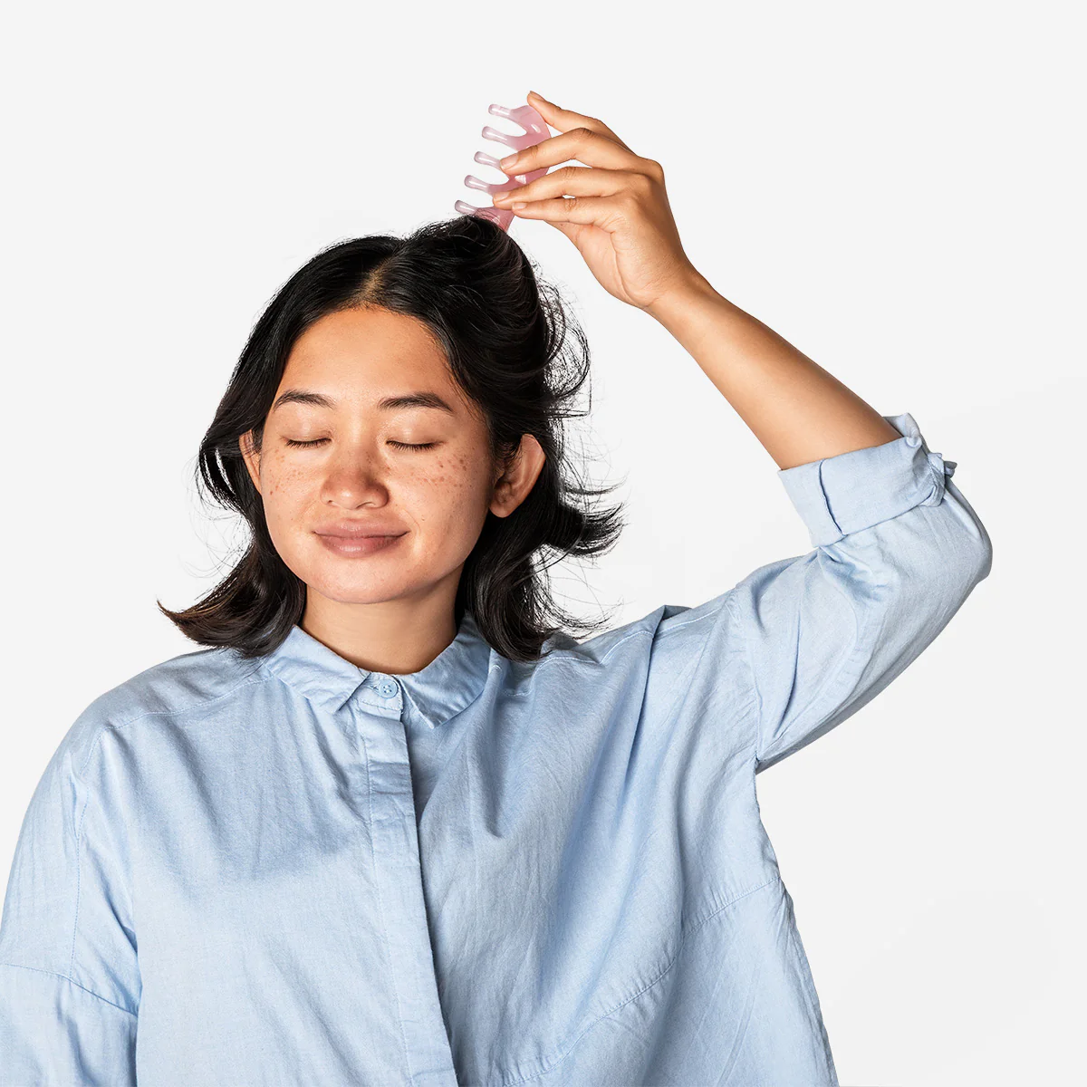 Pink gua sha tool for scalp massages