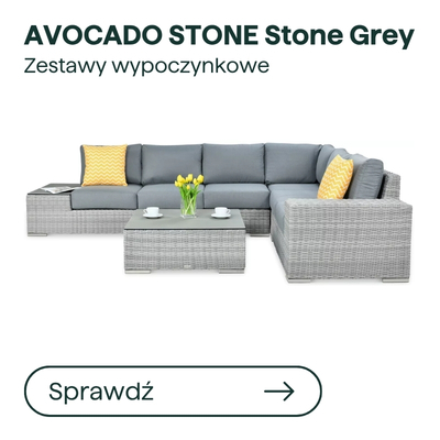 Stone grey outdoor rattan corner sofa with grey cushions, coffee table, yellow accent pillows and vase of tulips
