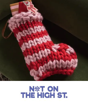 NOTHS - Crocheted stocking with present hanging out the top
