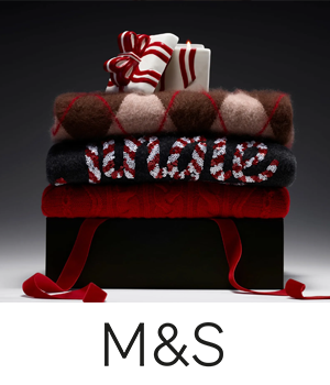 M&S - Present box with assorted Christmas jumpers laid on it