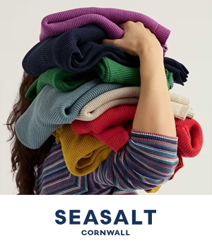Seasalt: Person holding a stack of jumpers