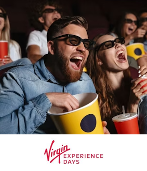 Virgin Experience Days: Couple laughing at cinema with a bowl of popcorn and drinks