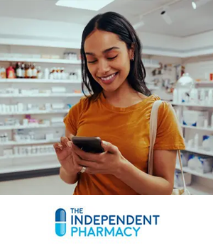 The Independent Pharmacy - Woman in pharmacy looking at phone