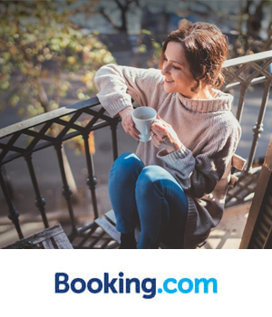 Booking.com: Woman drinking a coffee on a balcony