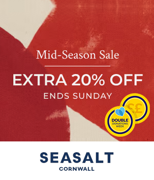 Seasalt - Man wearing striped polo shirt in coastal setting