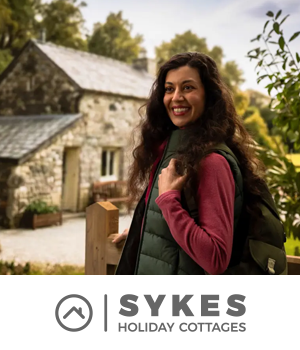 Sykes Holiday Cottages - Woman hiking in English countryside