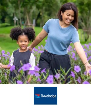 Travelodge - Mother and daughter walking through a flower field