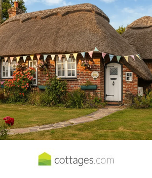 Cottages.com - Cottage with thatched roof and Easter themed bunting