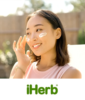 iHerb - Woman applying sunscreen on her cheeks